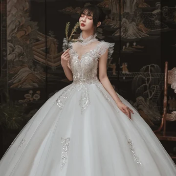 Vintage Originale Ivoire Jardin Extérieur Robe De Mariée 2020 Robe Boule Transparentes Col Haut Sans Manches Dos Nu Appliques Paillettes Perlage Longue Volants