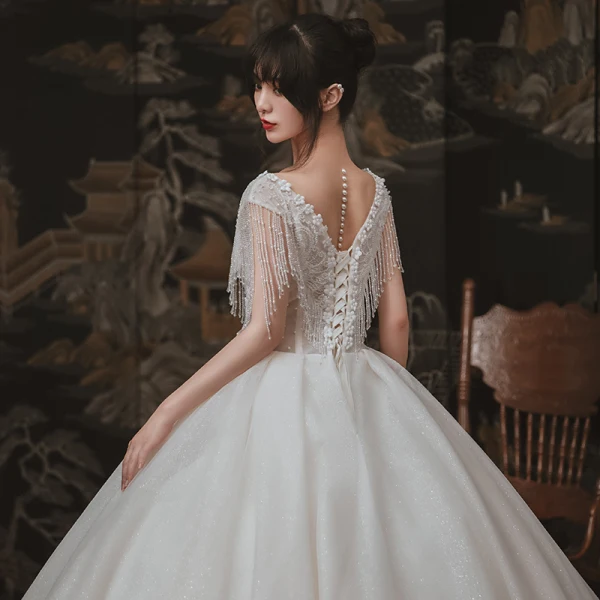 Elegant Ivory Outdoor / Garden Wedding Dresses 2020 Ball Gown See-through Deep V-Neck Sleeveless Backless Appliques Flower Pearl Beading Tassel Glitter Tulle Floor-Length / Long Ruffle