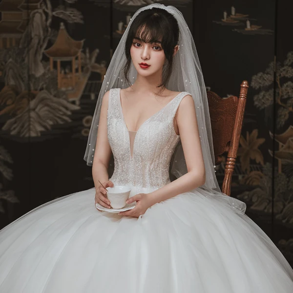 Chic / Beautiful Ivory Outdoor / Garden Wedding Dresses 2020 Ball Gown See-through Deep V-Neck Sleeveless Backless Beading Floor-Length / Long Ruffle