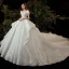 Style Victorien Ivoire La Mariée Robe De Mariée 2020 Robe Boule Transparentes Encolure Dégagée Gonflée Manches Courtes Dos Nu Appliques Fleur En Dentelle Perlage Paillettes Cathedral Train Volants