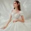 Style Victorien Ivoire La Mariée Robe De Mariée 2020 Robe Boule Transparentes Encolure Dégagée Gonflée Manches Courtes Dos Nu Appliques Fleur En Dentelle Perlage Paillettes Cathedral Train Volants