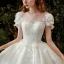 Style Victorien Ivoire La Mariée Robe De Mariée 2020 Robe Boule Transparentes Encolure Dégagée Gonflée Manches Courtes Dos Nu Appliques Fleur En Dentelle Perlage Paillettes Cathedral Train Volants