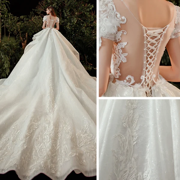 Style Victorien Ivoire La Mariée Robe De Mariée 2020 Robe Boule Transparentes Encolure Dégagée Gonflée Manches Courtes Dos Nu Appliques Fleur En Dentelle Perlage Paillettes Cathedral Train Volants