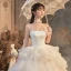Romantique Ivoire La Mariée Robe De Mariée 2020 Robe Boule Bustier Sans Manches Dos Nu Glitter Tulle Cathedral Train Volants