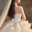 Romantique Ivoire La Mariée Robe De Mariée 2020 Robe Boule Bustier Sans Manches Dos Nu Glitter Tulle Cathedral Train Volants