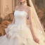 Romantique Ivoire La Mariée Robe De Mariée 2020 Robe Boule Bustier Sans Manches Dos Nu Glitter Tulle Cathedral Train Volants