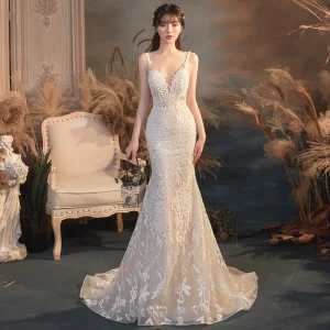 Illusion Champagne Transparentes La Mariée Robe De Mariée 2020 Trompette Sirène Encolure Dégagée Sans Manches Dos Nu Appliques En Dentelle Perlage Train De Balayage Volants