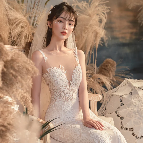 Illusion Champagne Transparentes La Mariée Robe De Mariée 2020 Trompette / Sirène Encolure Dégagée Sans Manches Dos Nu Appliques En Dentelle Perlage Train De Balayage Volants