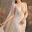 Illusion Champagne Transparentes La Mariée Robe De Mariée 2020 Trompette / Sirène Encolure Dégagée Sans Manches Dos Nu Appliques En Dentelle Perlage Train De Balayage Volants