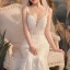 Illusion Champagne Transparentes La Mariée Robe De Mariée 2020 Trompette / Sirène Encolure Dégagée Sans Manches Dos Nu Appliques En Dentelle Perlage Train De Balayage Volants