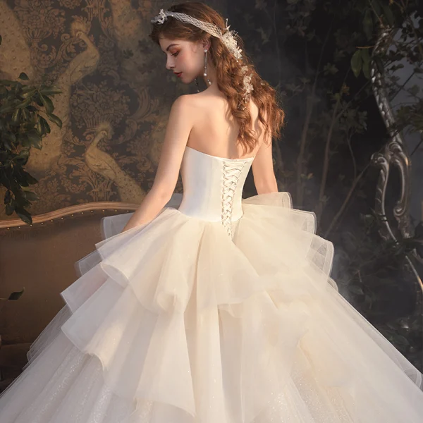 Luxury / Gorgeous Champagne Bridal Wedding Dresses 2020 Ball Gown Strapless Sleeveless Backless Glitter Tulle Cathedral Train Ruffle