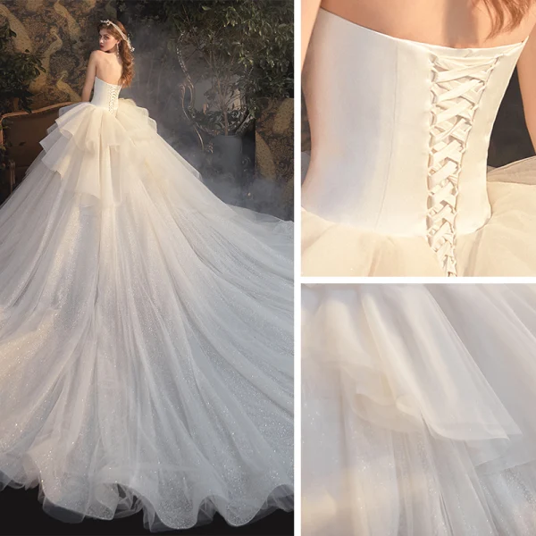 Luxury / Gorgeous Champagne Bridal Wedding Dresses 2020 Ball Gown Strapless Sleeveless Backless Glitter Tulle Cathedral Train Ruffle