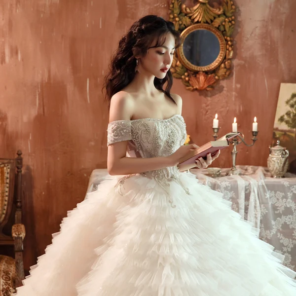 Stunning Champagne Bridal Wedding Dresses 2020 Ball Gown Off-The-Shoulder Short Sleeve Backless Beading Cascading Ruffles Cathedral Train