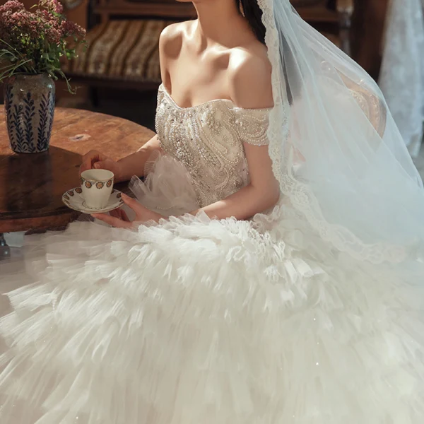 Stunning Champagne Bridal Wedding Dresses 2020 Ball Gown Off-The-Shoulder Short Sleeve Backless Beading Cascading Ruffles Cathedral Train