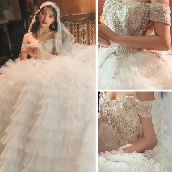 Stunning Champagne Bridal Wedding Dresses 2020 Ball Gown Off-The-Shoulder Short Sleeve Backless Beading Cascading Ruffles Cathedral Train