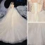 Romantique Champagne La Mariée Robe De Mariée 2020 Princesse Transparentes Encolure Dégagée Sans Manches Dos Nu Appliques En Dentelle Perlage Glitter Tulle Chapel Train Volants