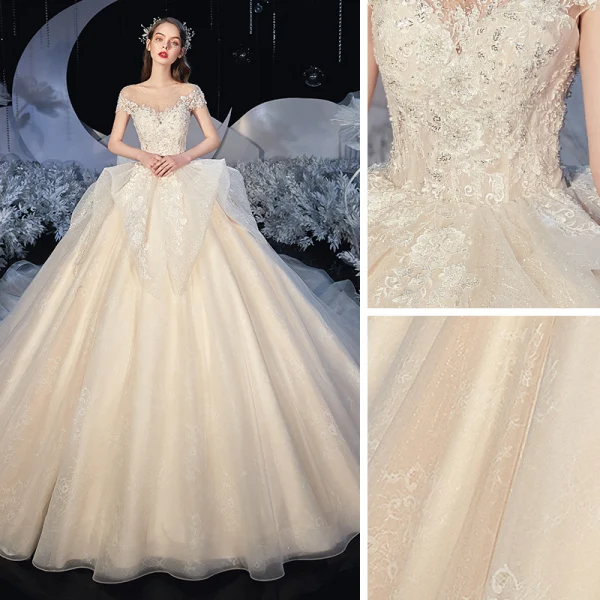 Romantique Champagne La Mariée Robe De Mariée 2020 Princesse Transparentes Encolure Dégagée Sans Manches Dos Nu Appliques En Dentelle Perlage Glitter Tulle Chapel Train Volants