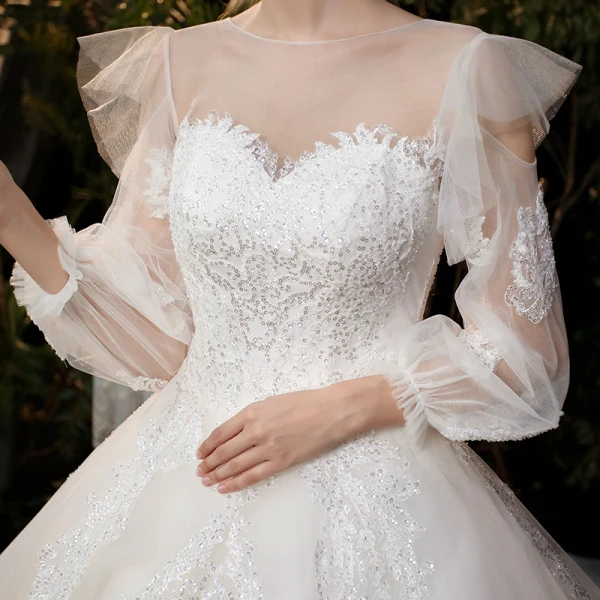 Victorian Style Champagne Bridal Wedding Dresses 2020 Ball Gown See-through Scoop Neck Puffy Long Sleeve Backless Appliques Sequins Cathedral Train Ruffle