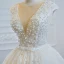 Luxe Ivoire La Mariée Robe De Mariée 2020 Robe Boule Transparentes Col v profond Sans Manches Dos Nu Appliques En Dentelle Perlage Perle Noeud Ceinture