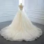 Luxe Ivoire La Mariée Robe De Mariée 2020 Robe Boule Transparentes Col v profond Sans Manches Dos Nu Appliques En Dentelle Perlage Perle Noeud Ceinture