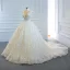 Luxe Ivoire La Mariée Robe De Mariée 2020 Robe Boule Transparentes Col v profond Sans Manches Dos Nu Appliques En Dentelle Perlage Perle Noeud Ceinture