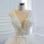 Luxe Ivoire La Mariée Robe De Mariée 2020 Robe Boule Transparentes Col v profond Sans Manches Dos Nu Appliques En Dentelle Perlage Perle Noeud Ceinture