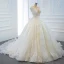 Luxe Ivoire La Mariée Robe De Mariée 2020 Robe Boule Transparentes Col v profond Sans Manches Dos Nu Appliques En Dentelle Perlage Perle Noeud Ceinture
