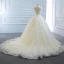 Luxe Ivoire La Mariée Robe De Mariée 2020 Robe Boule Transparentes Col v profond Sans Manches Dos Nu Appliques En Dentelle Perlage Perle Noeud Ceinture