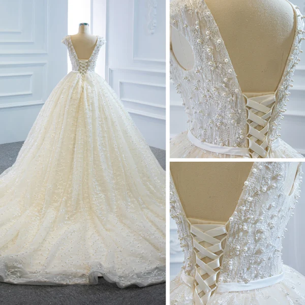 Luxe Ivoire La Mariée Robe De Mariée 2020 Robe Boule Transparentes Col v profond Sans Manches Dos Nu Appliques En Dentelle Perlage Perle Noeud Ceinture