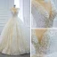 Luxe Ivoire La Mariée Robe De Mariée 2020 Robe Boule Transparentes Col v profond Sans Manches Dos Nu Appliques En Dentelle Perlage Perle Noeud Ceinture