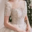 Luxe Champagne La Mariée Robe De Mariée 2020 Robe Boule Transparentes Encolure Dégagée Manches Courtes Dos Nu Fait main Perlage Paillettes Glitter Tulle Cathedral Train Volants