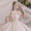 Luxe Champagne La Mariée Robe De Mariée 2020 Robe Boule Transparentes Encolure Dégagée Manches Courtes Dos Nu Fait main Perlage Paillettes Glitter Tulle Cathedral Train Volants