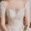 Luxe Champagne La Mariée Robe De Mariée 2020 Robe Boule Transparentes Encolure Dégagée Manches Courtes Dos Nu Fait main Perlage Paillettes Glitter Tulle Cathedral Train Volants