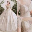 Luxe Champagne La Mariée Robe De Mariée 2020 Robe Boule Transparentes Encolure Dégagée Manches Courtes Dos Nu Fait main Perlage Paillettes Glitter Tulle Cathedral Train Volants