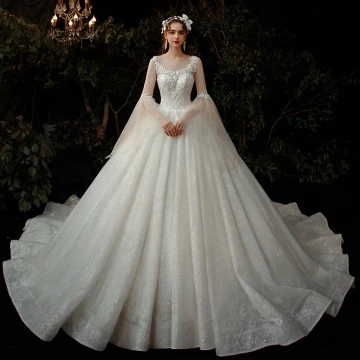 Romantic Champagne Wedding Dresses 2020 Ball Gown See Through Scoop Neck Bell Sleeves Backless Beading Glitter Tulle Cathedral Train Ruffle