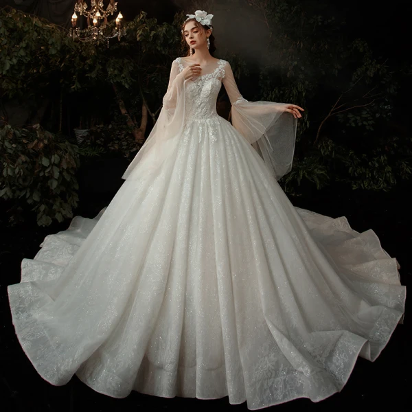 Romantique Champagne Robe De Mariée 2020 Robe Boule Transparentes Encolure Dégagée Manches de cloche Dos Nu Perlage Glitter Tulle Cathedral Train Volants