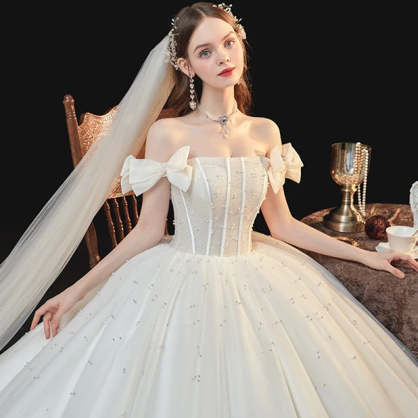 Best White Bridal Wedding Dresses 2020 Ball Gown Off-The-Shoulder Bow Short Sleeve Backless Beading Pearl Glitter Tulle Cathedral Train Ruffle