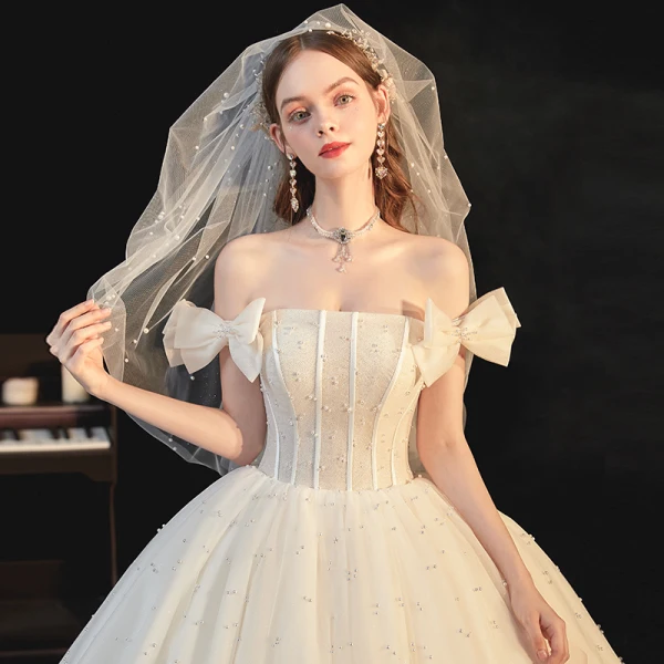 Best White Bridal Wedding Dresses 2020 Ball Gown Off-The-Shoulder Bow Short Sleeve Backless Beading Pearl Glitter Tulle Cathedral Train Ruffle