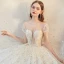 Luxe Blanche La Mariée Robe De Mariée 2020 Robe Boule Transparentes Encolure Dégagée Manches Courtes Dos Nu Paillettes Perlage Glitter Tulle Cathedral Train Volants