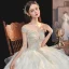 Luxe Champagne La Mariée Robe De Mariée 2020 Robe Boule Transparentes Encolure Dégagée Manches Courtes Dos Nu Glitter Tulle Paillettes Perlage Cathedral Train Volants