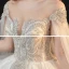 Luxe Champagne La Mariée Robe De Mariée 2020 Robe Boule Transparentes Encolure Dégagée Manches Courtes Dos Nu Glitter Tulle Paillettes Perlage Cathedral Train Volants