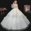 Fabuleux Champagne La Mariée Robe De Mariée 2020 Robe Boule Transparentes Encolure Carrée Manches Longues Dos Nu Fait main Perlage Perle Glitter Tulle Cathedral Train Volants