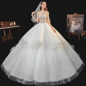 Fabuloso Champán Boda Vestidos De Novia 2020 Ball Gown Transparentes Escote Cuadrado Manga Larga Sin Espalda Hecho A Mano Rebordear Perla Glitter Tul Cathedral Train Ruffle
