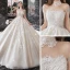 Vintage / Originale Champagne La Mariée Robe De Mariée 2020 Robe Boule Transparentes Col Haut Manches Courtes Perlage Gland Dos Nu Appliques En Dentelle Cathedral Train Volants