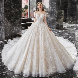 Encantador Champán Boda Vestidos De Novia 2020 Ball Gown Transparentes Scoop Escote Manga Corta Rebordear Tassel Sin Espalda Apliques Con Encaje Cathedral Train Ruffle