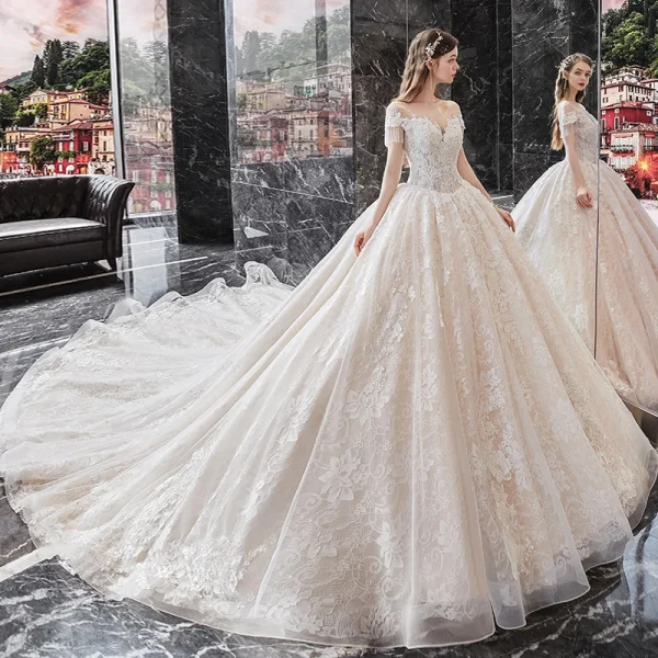 Charming Champagne Bridal Wedding Dresses 2020 Ball Gown See-through Scoop Neck Short Sleeve Beading Tassel Backless Appliques Lace Cathedral Train Ruffle