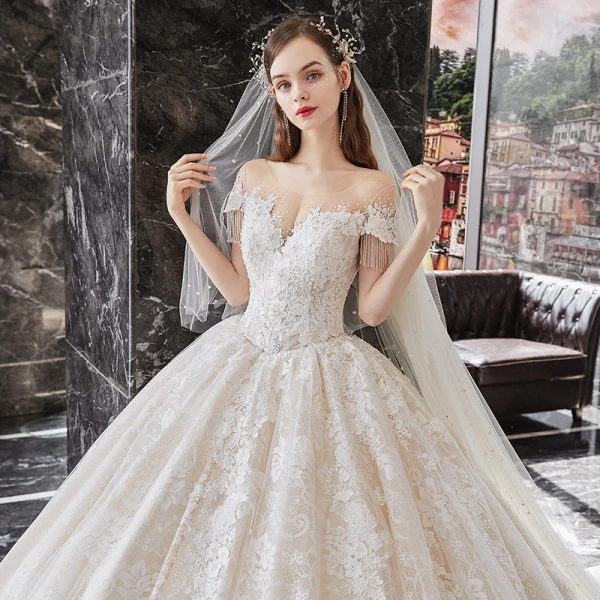 Charming Champagne Bridal Wedding Dresses 2020 Ball Gown See-through Scoop Neck Short Sleeve Beading Tassel Backless Appliques Lace Cathedral Train Ruffle