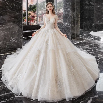 Best Champagne Bridal Wedding Dresses 2020 Ball Gown See Through Scoop Neck Long Sleeve Backless Sequins Beading Glitter Tulle Cathedral Train Ruffle