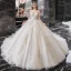 Meilleur Champagne La Mariée Robe De Mariée 2020 Robe Boule Transparentes Encolure Dégagée Manches Longues Dos Nu Paillettes Perlage Glitter Tulle Cathedral Train Volants