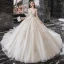 Meilleur Champagne La Mariée Robe De Mariée 2020 Robe Boule Transparentes Encolure Dégagée Manches Longues Dos Nu Paillettes Perlage Glitter Tulle Cathedral Train Volants